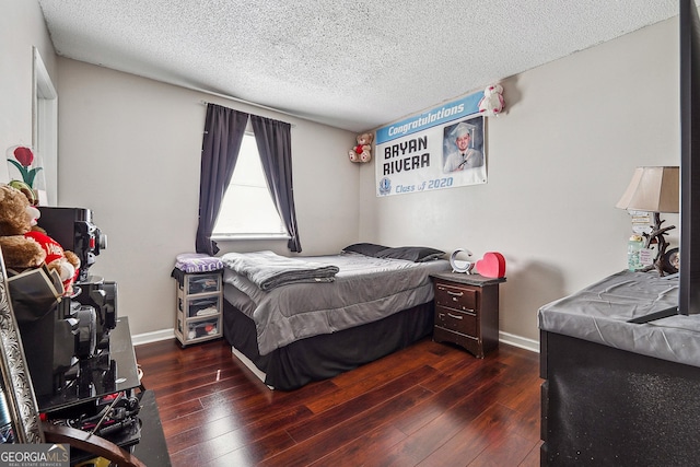 5022 Audubon Pl, Norcross, GA 30093 - bedroom with a textured ceiling, baseboards, and hardwood / wood-style floors