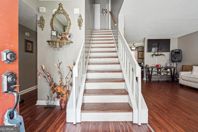 5022 Audubon Pl, Norcross, GA 30093 - staircase featuring a textured ceiling, baseboards, ceiling fan, and wood finished floors
