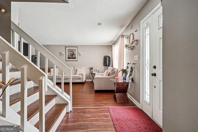 5022 Audubon Pl, Norcross, GA 30093 - foyer entrance featuring a textured ceiling, a healthy amount of sunlight, stairway, and dark wood-type flooring
