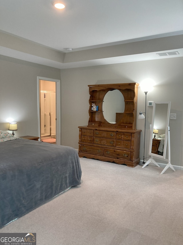 carpeted bedroom with baseboards and visible vents