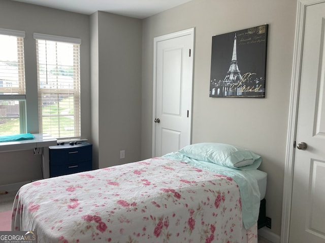 bedroom featuring multiple windows