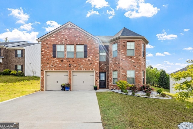 400 Toronto Cir, Hampton, GA 30228 - view of front of property featuring an attached garage, driveway, a front lawn, and brick siding