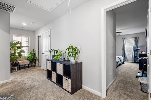 400 Toronto Cir, Hampton, GA 30228 - hall with baseboards, carpet, attic access, and visible vents