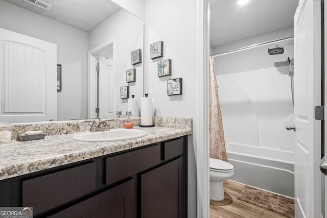 400 Toronto Cir, Hampton, GA 30228 - full bathroom featuring visible vents, vanity, wood finished floors, toilet, and shower / bathtub combination with curtain