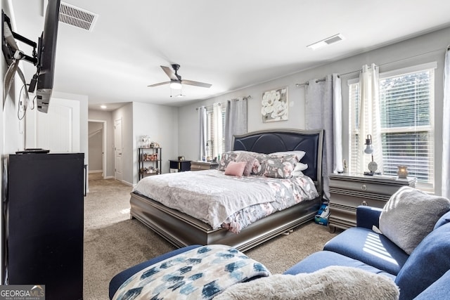 400 Toronto Cir, Hampton, GA 30228 - carpeted bedroom featuring a ceiling fan, visible vents, and multiple windows