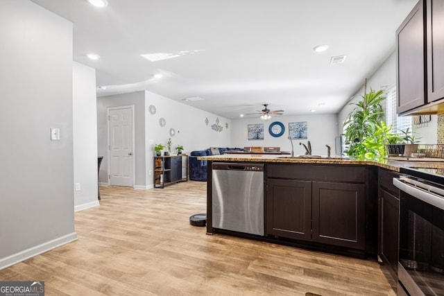 400 Toronto Cir, Hampton, GA 30228 - kitchen with a sink, a peninsula, recessed lighting, a ceiling fan, and appliances with stainless steel finishes