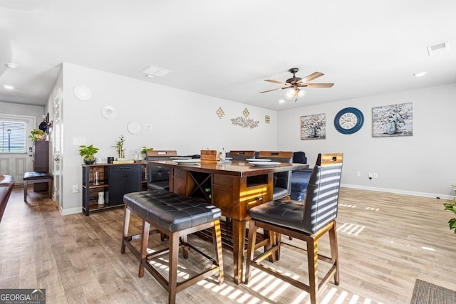 400 Toronto Cir, Hampton, GA 30228 - dining space with light wood-type flooring, baseboards, ceiling fan, and visible vents