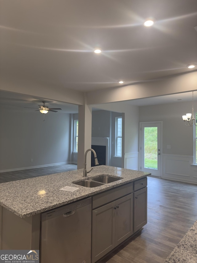 1155 Park Center Cir NW, Austell, GA 30168 - kitchen featuring a kitchen island with sink, a fireplace, dishwasher, a sink, and open floor plan