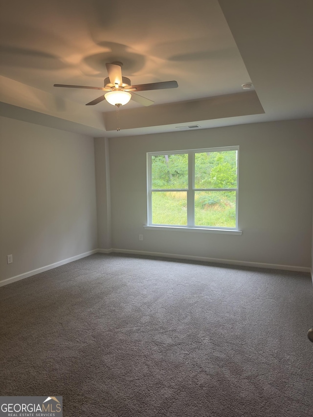 1155 Park Center Cir NW, Austell, GA 30168 - unfurnished room featuring ceiling fan, carpet, baseboards, a tray ceiling, and visible vents