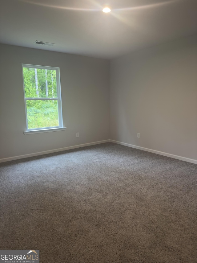 1155 Park Center Cir NW, Austell, GA 30168 - empty room with baseboards, dark colored carpet, and visible vents