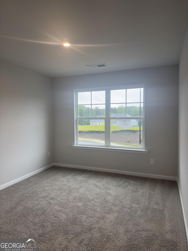 1155 Park Center Cir NW, Austell, GA 30168 - unfurnished room featuring baseboards, carpet flooring, and a wealth of natural light