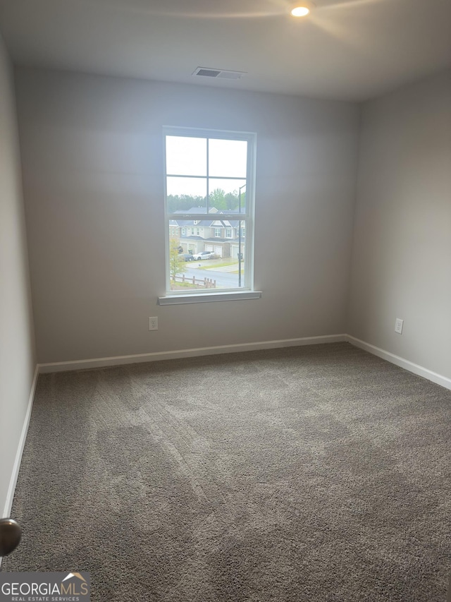 1155 Park Center Cir NW, Austell, GA 30168 - spare room featuring carpet flooring, baseboards, and visible vents