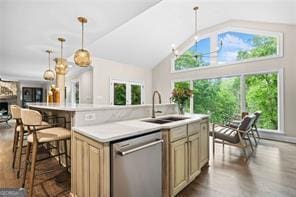 8190 Old Mill Dr, Gainesville, GA 30506 - kitchen featuring stainless steel dishwasher, a sink, light countertops, a center island with sink, and cream cabinets
