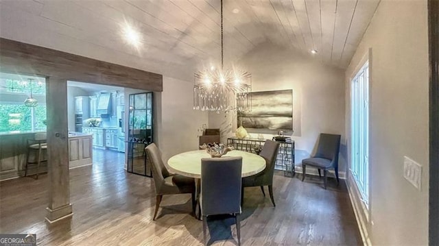 dining room with a chandelier, vaulted ceiling, wood ceiling, and wood finished floors