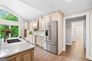 8190 Old Mill Dr, Gainesville, GA 30506 - kitchen with high end fridge, a sink, custom exhaust hood, light countertops, and lofted ceiling