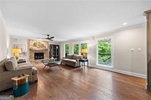 8190 Old Mill Dr, Gainesville, GA 30506 - living room featuring a ceiling fan, a fireplace, wood finished floors, and baseboards