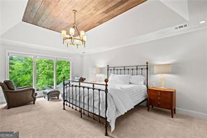 8190 Old Mill Dr, Gainesville, GA 30506 - bedroom featuring a chandelier, carpet, a tray ceiling, baseboards, and wooden ceiling