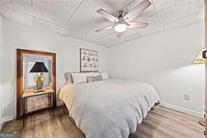 8190 Old Mill Dr, Gainesville, GA 30506 - bedroom featuring wood finished floors, baseboards, a paneled ceiling, and a ceiling fan