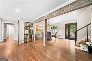 8190 Old Mill Dr, Gainesville, GA 30506 - living area featuring stairway, ornamental molding, wood finished floors, and baseboards