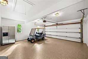 8190 Old Mill Dr, Gainesville, GA 30506 - garage with stainless steel fridge