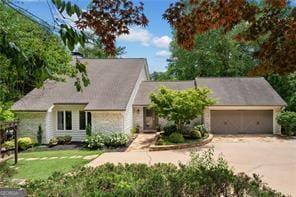 8190 Old Mill Dr, Gainesville, GA 30506 - view of front facade with concrete driveway, an attached garage, and a front lawn