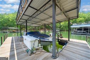 8190 Old Mill Dr, Gainesville, GA 30506 - dock featuring a water view and boat lift