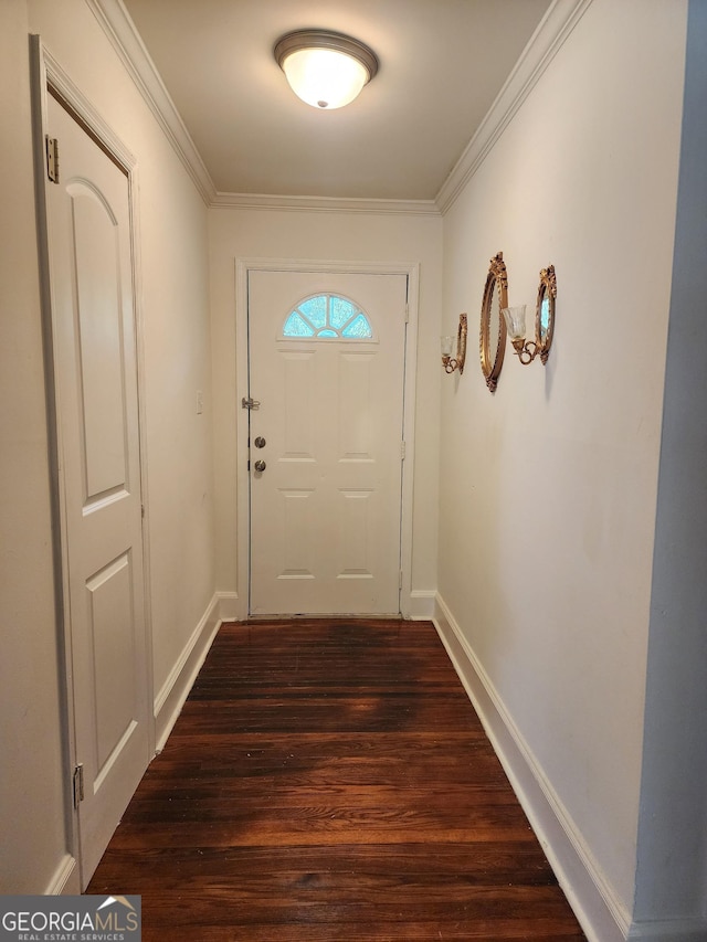 doorway with crown molding, baseboards, and dark wood finished floors