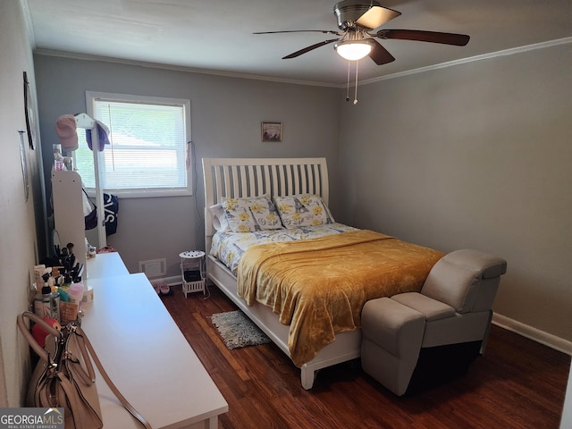 bedroom featuring visible vents, ornamental molding, a ceiling fan, and wood finished floors