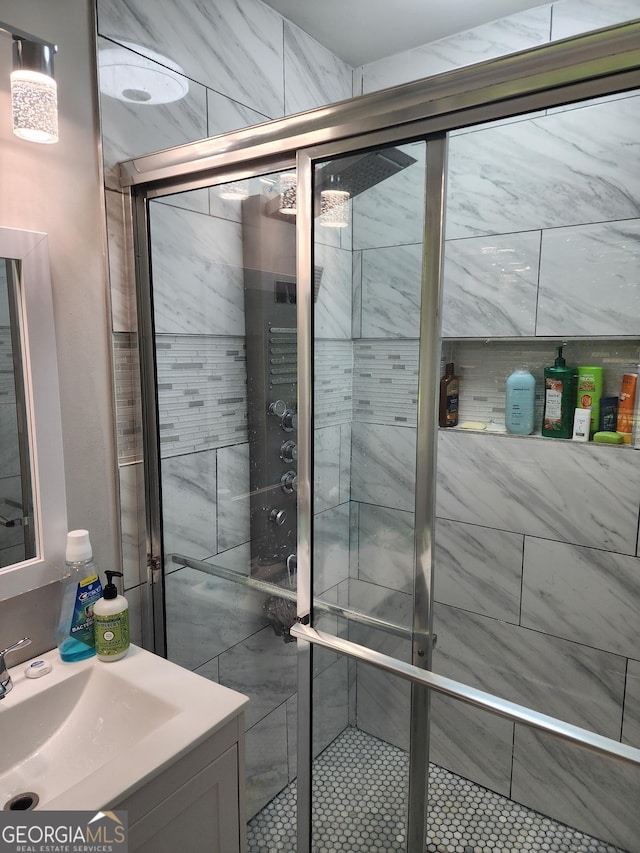 bathroom featuring a shower stall