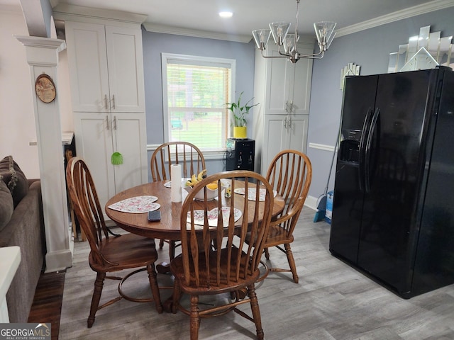 dining space with crown molding, a notable chandelier, light wood finished floors, recessed lighting, and baseboards