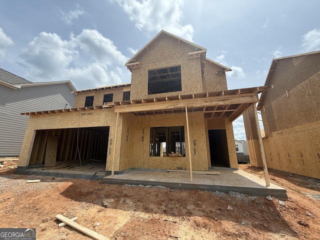 back of house with a patio