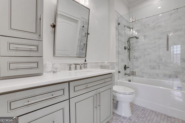 full bath featuring toilet, vanity, shower / bathtub combination, tile patterned floors, and crown molding