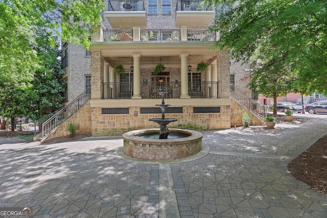 doorway to property featuring brick siding