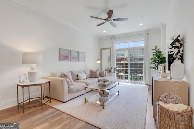 living area featuring ceiling fan, wood finished floors, crown molding, recessed lighting, and baseboards