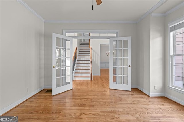 4876 Sara Creek Way, Sugar Hill, GA 30518 - empty room featuring a wealth of natural light, french doors, and light wood-style flooring