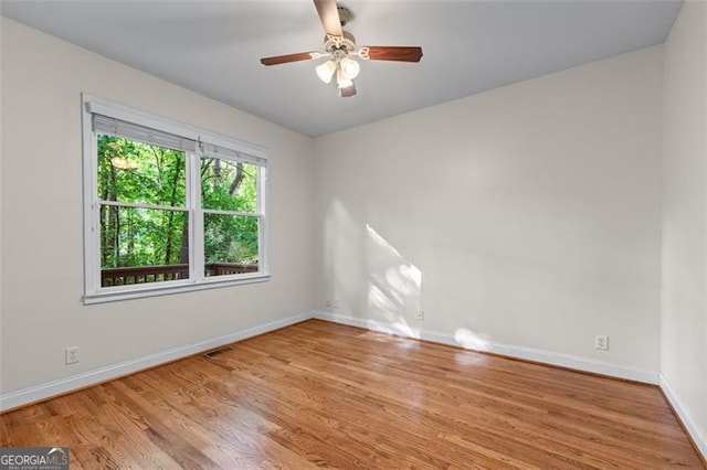 4876 Sara Creek Way, Sugar Hill, GA 30518 - empty room featuring baseboards, ceiling fan, wood finished floors, and visible vents