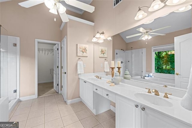 4876 Sara Creek Way, Sugar Hill, GA 30518 - bathroom with ceiling fan, a sink, visible vents, lofted ceiling with skylight, and a stall shower