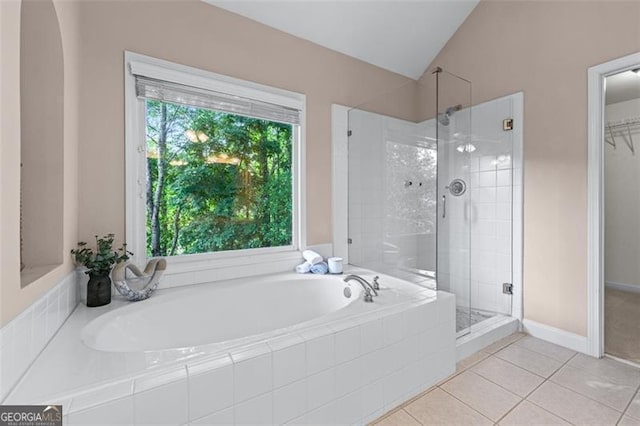 4876 Sara Creek Way, Sugar Hill, GA 30518 - full bathroom featuring vaulted ceiling, tile patterned flooring, a shower stall, and a bath