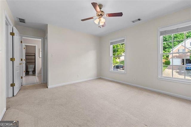 4876 Sara Creek Way, Sugar Hill, GA 30518 - unfurnished bedroom with baseboards, multiple windows, light colored carpet, and visible vents