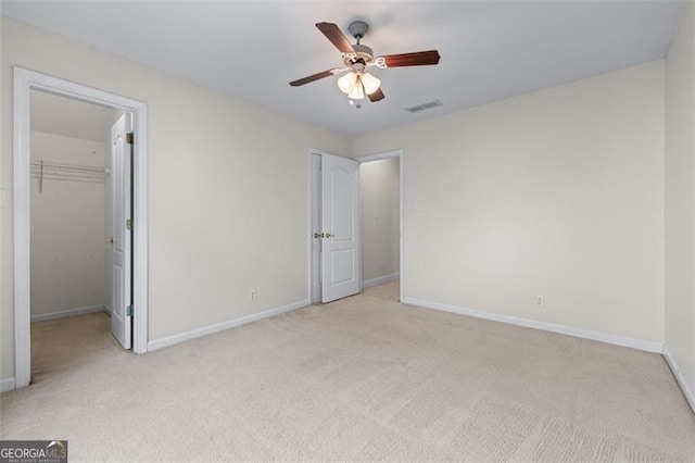 4876 Sara Creek Way, Sugar Hill, GA 30518 - unfurnished bedroom featuring baseboards, light carpet, and visible vents