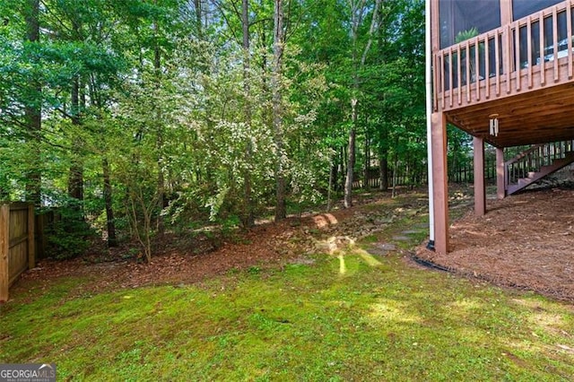 4876 Sara Creek Way, Sugar Hill, GA 30518 - view of yard with stairway, a deck, and fence