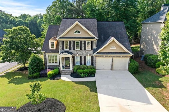 4876 Sara Creek Way, Sugar Hill, GA 30518 - view of front facade featuring a garage, a front lawn, fence, stone siding, and concrete driveway