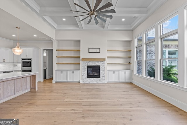 2824 Cork St, Braselton, GA 30517 - unfurnished living room featuring a stone fireplace, a ceiling fan, crown molding, light wood-type flooring, and recessed lighting
