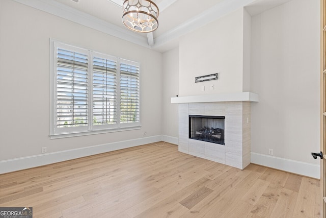 2824 Cork St, Braselton, GA 30517 - unfurnished living room with wood finished floors, a chandelier, and healthy amount of natural light