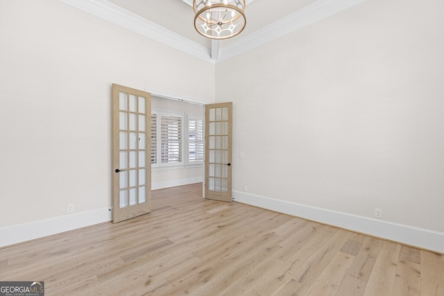 2824 Cork St, Braselton, GA 30517 - empty room featuring a chandelier, wood finished floors, baseboards, french doors, and ornamental molding