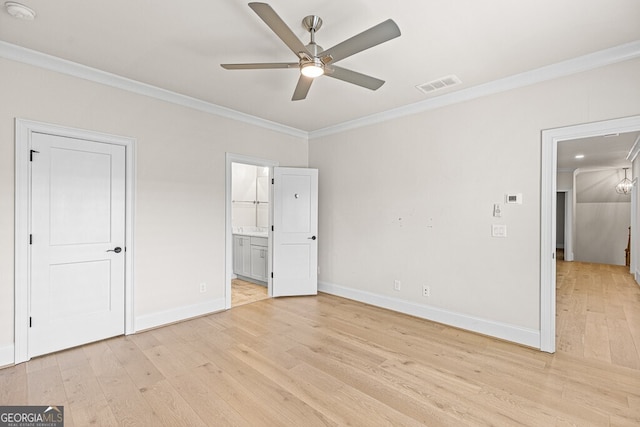 2824 Cork St, Braselton, GA 30517 - unfurnished bedroom featuring ornamental molding, light wood-style flooring, baseboards, ensuite bathroom, and ceiling fan