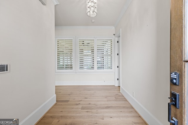 2824 Cork St, Braselton, GA 30517 - hall with crown molding, wood finished floors, and baseboards