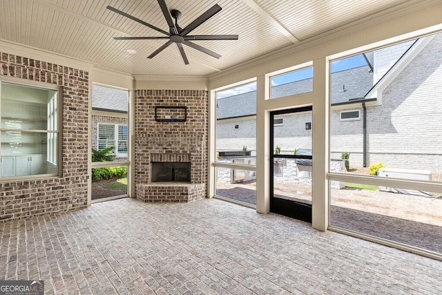2824 Cork St, Braselton, GA 30517 - unfurnished sunroom featuring an outdoor brick fireplace and a ceiling fan