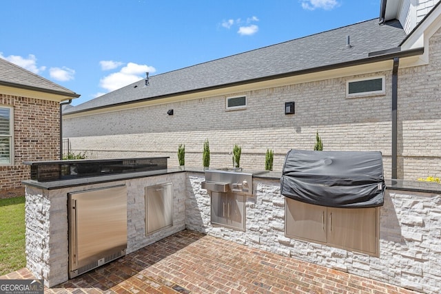 2824 Cork St, Braselton, GA 30517 - view of patio / terrace featuring an outdoor kitchen