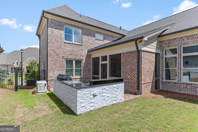 2824 Cork St, Braselton, GA 30517 - rear view of property with exterior kitchen, brick siding, and a sunroom